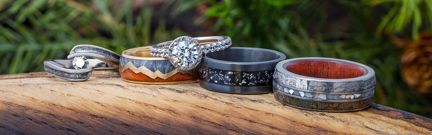 Handmade jewelry with unique materials like dinosaur bone and meteorite