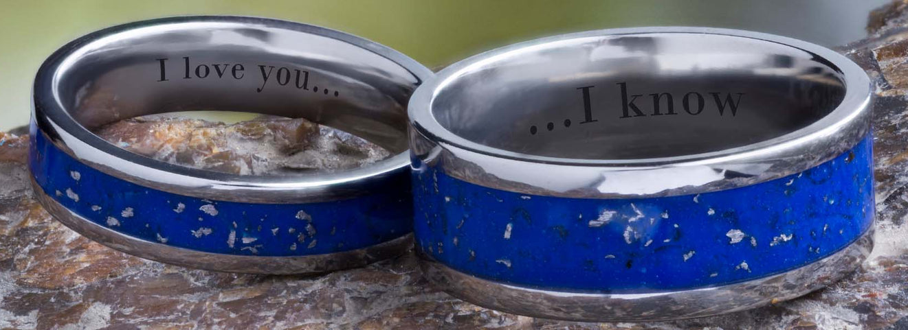 Two Stardust wedding bands with text engraving.