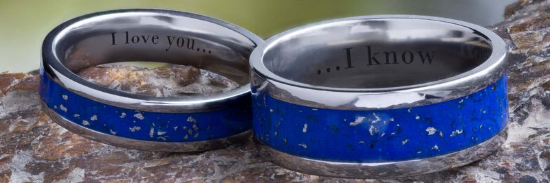Two Stardust wedding bands with text engraving.