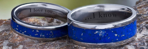 Two Stardust wedding bands with text engraving.