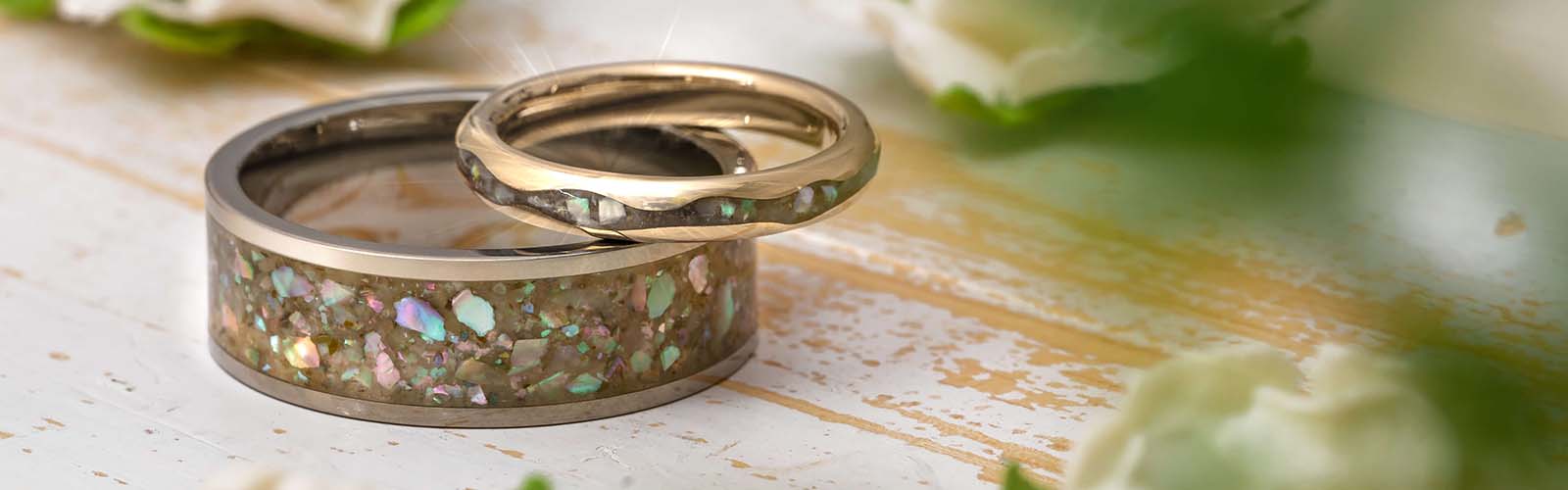 Abalone Wedding Rings on Wooden Table