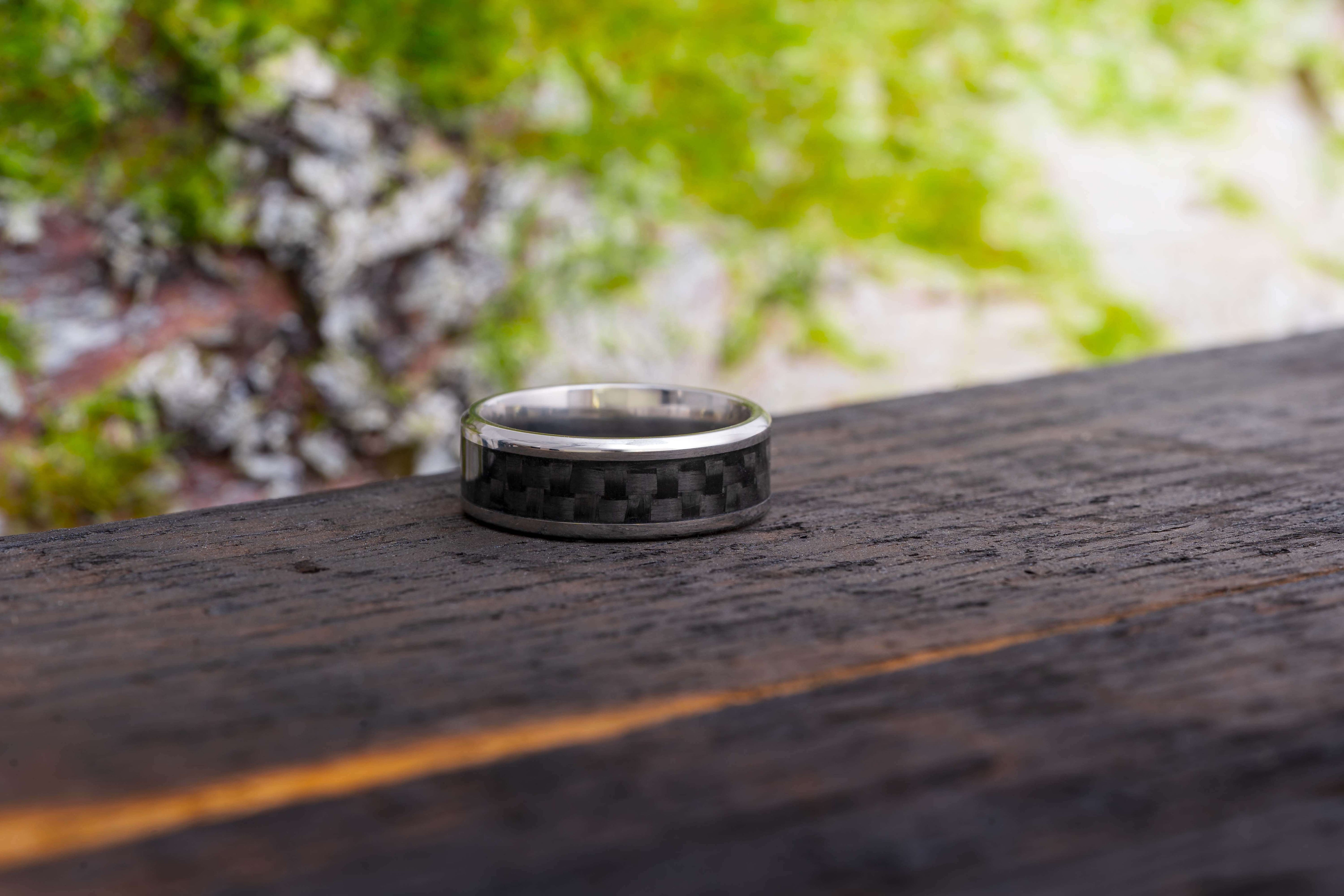 Elegant carbon fiber ring showcasing a sleek, modern design with a lustrous black finish, perfect for a sophisticated and contemporary style statement.