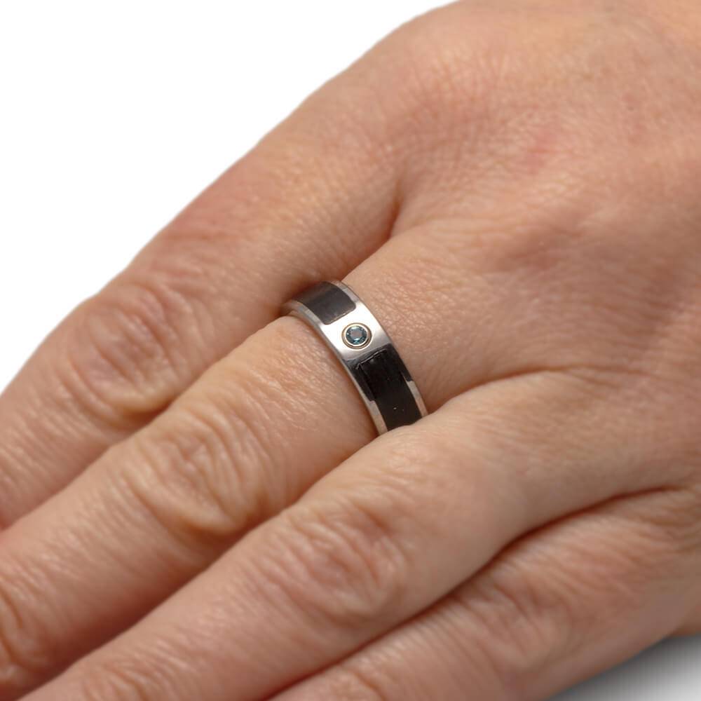 Vinyl record wedding ring with topaz on hand