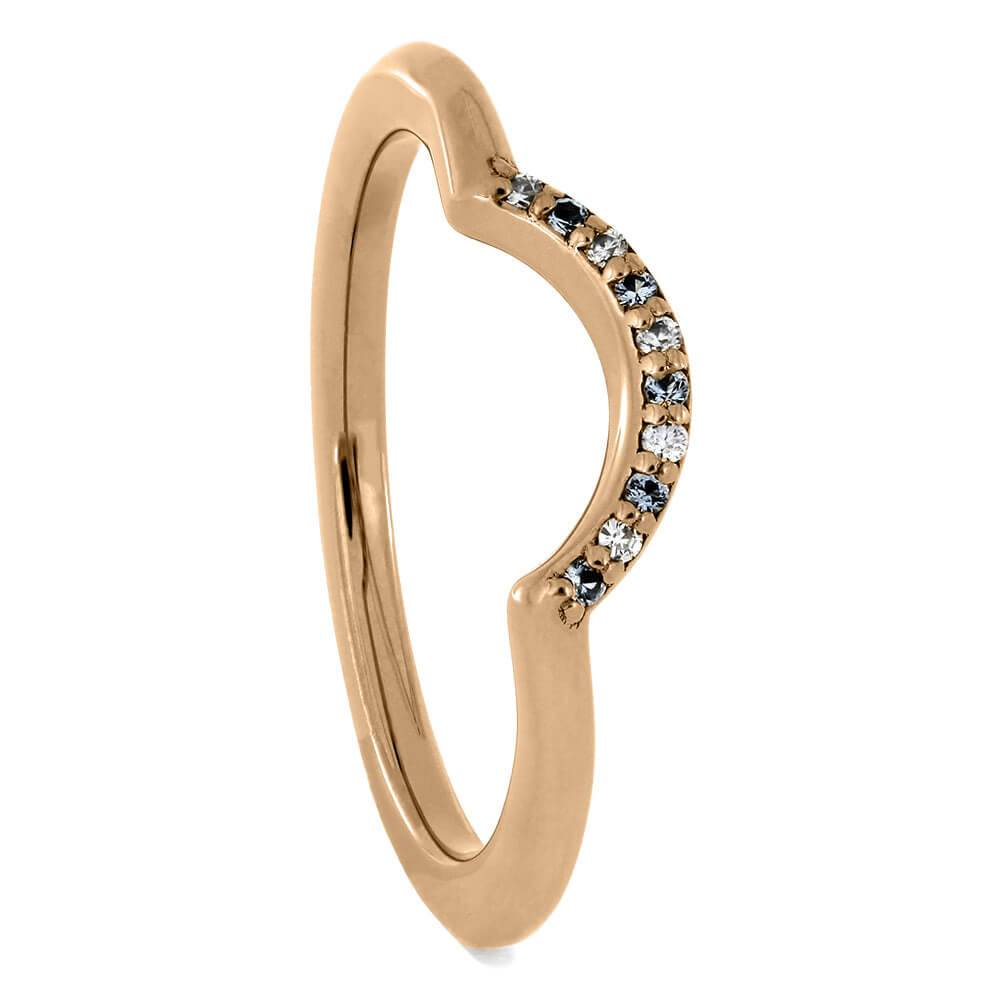 Rose gold wedding band with curved design and diamonds