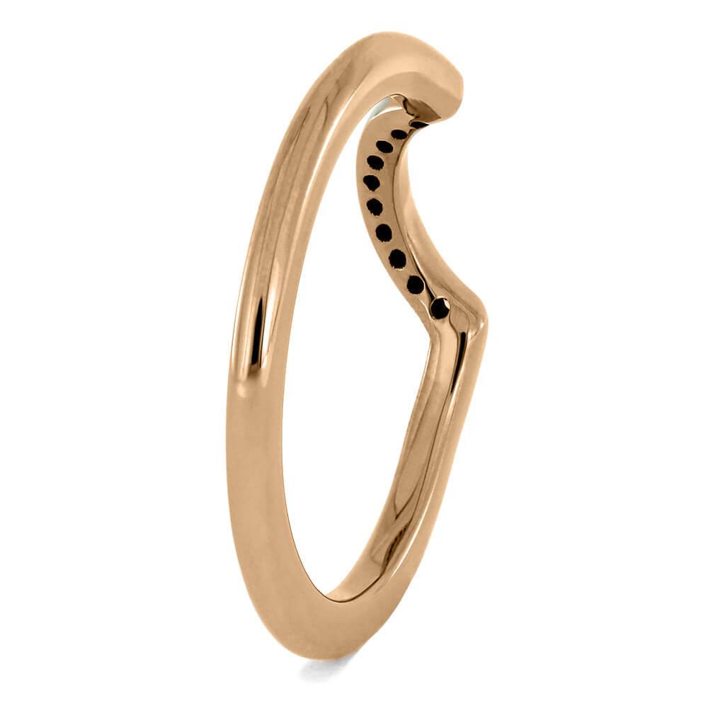Back view of rose gold wedding band with curved design