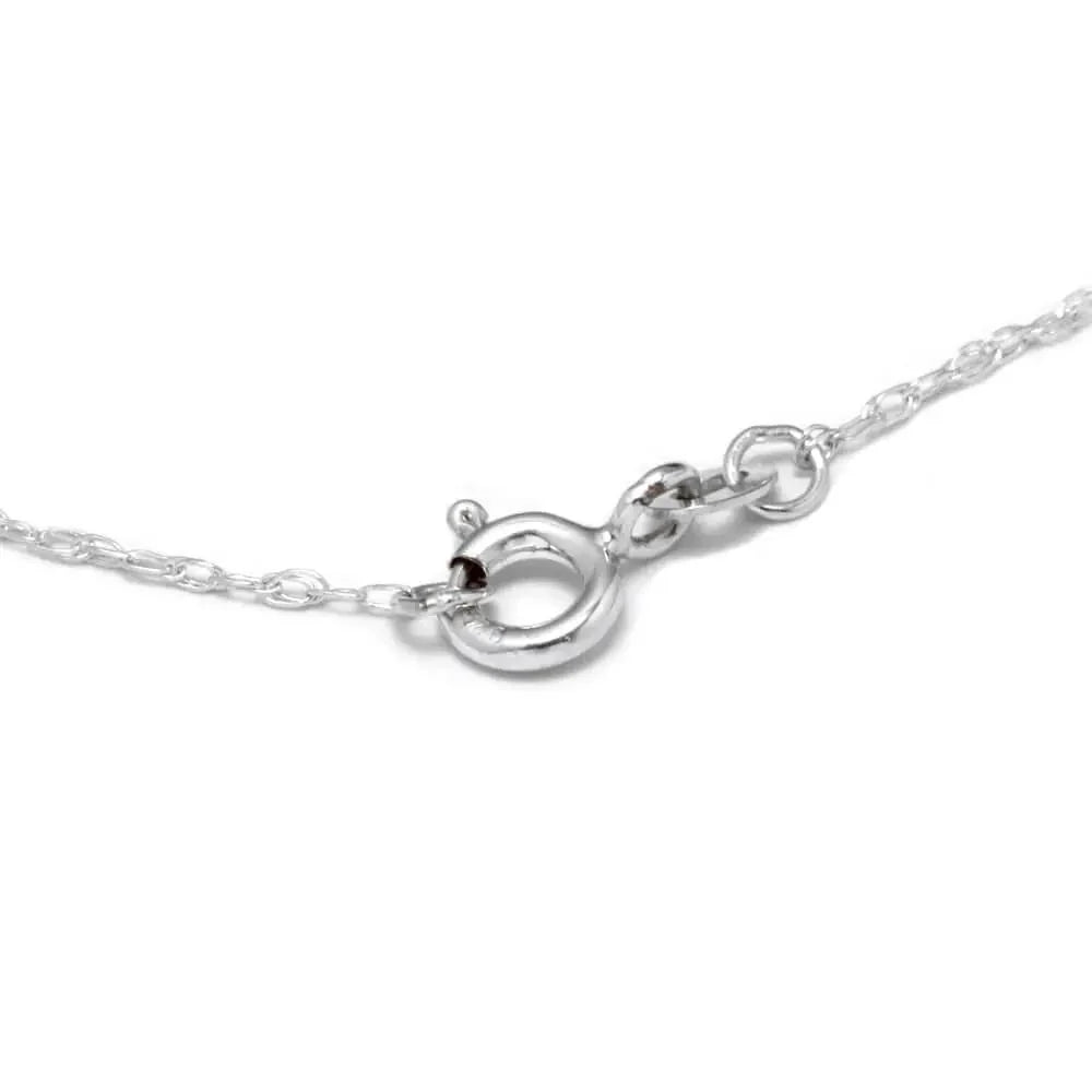 Close-up of a silver necklace clasp on a white background