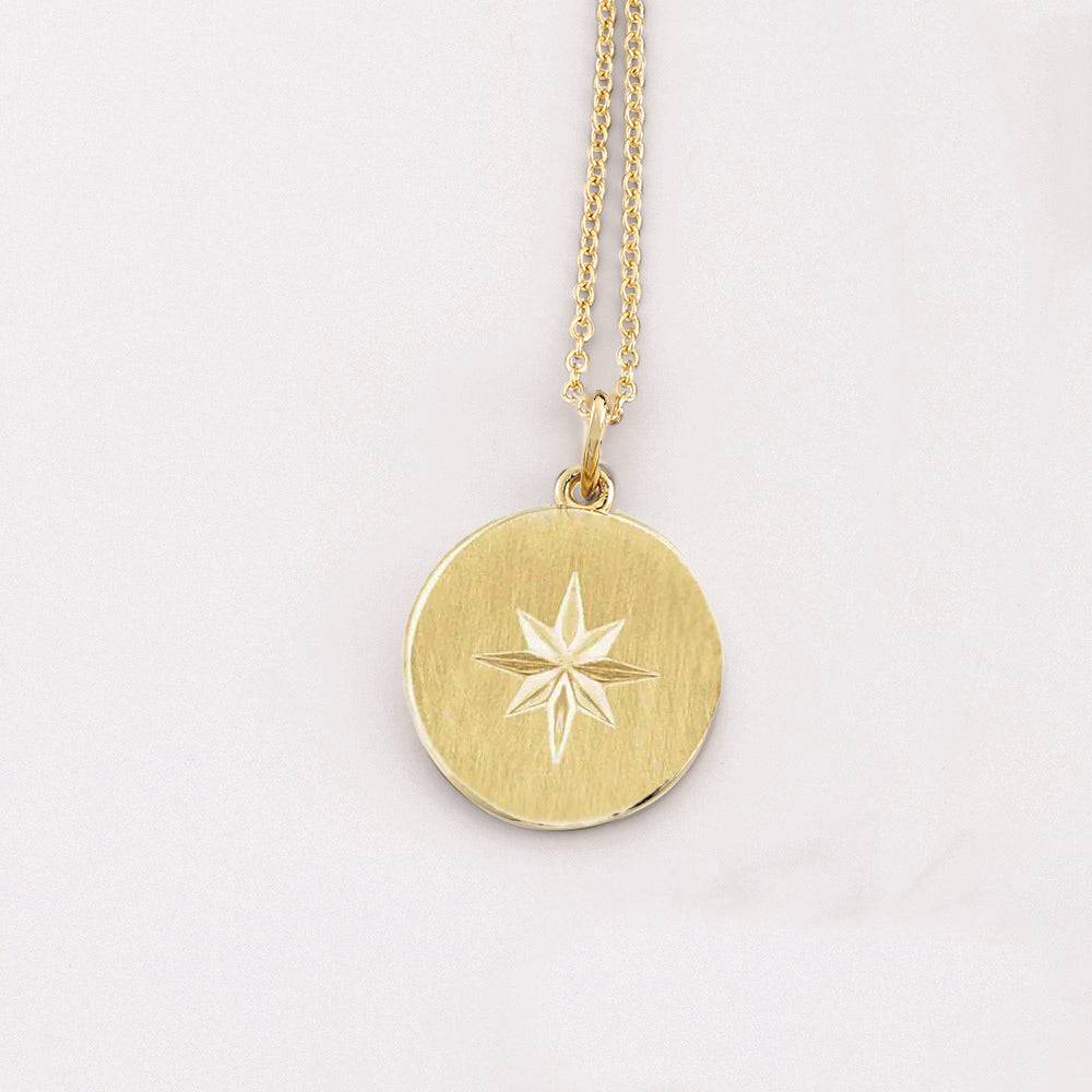 Yellow gold tiny circle necklace with starburst design
