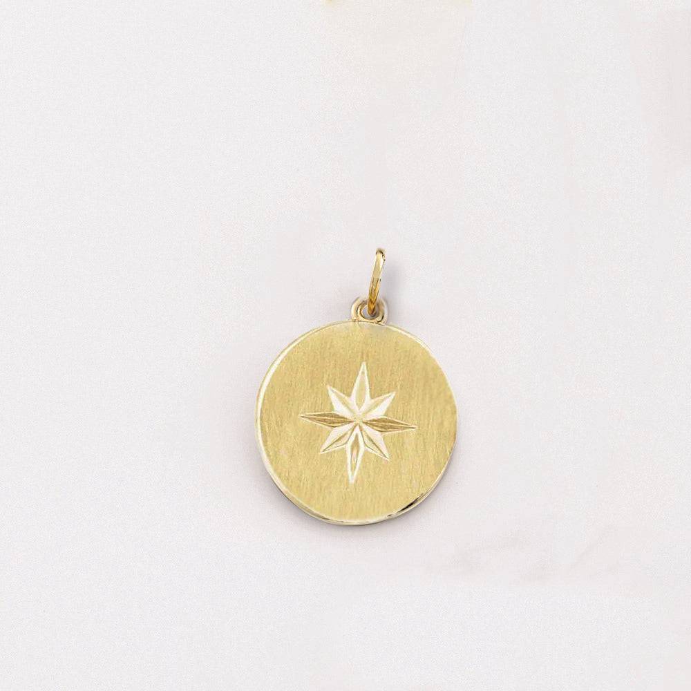 Yellow gold pendant with starburst design