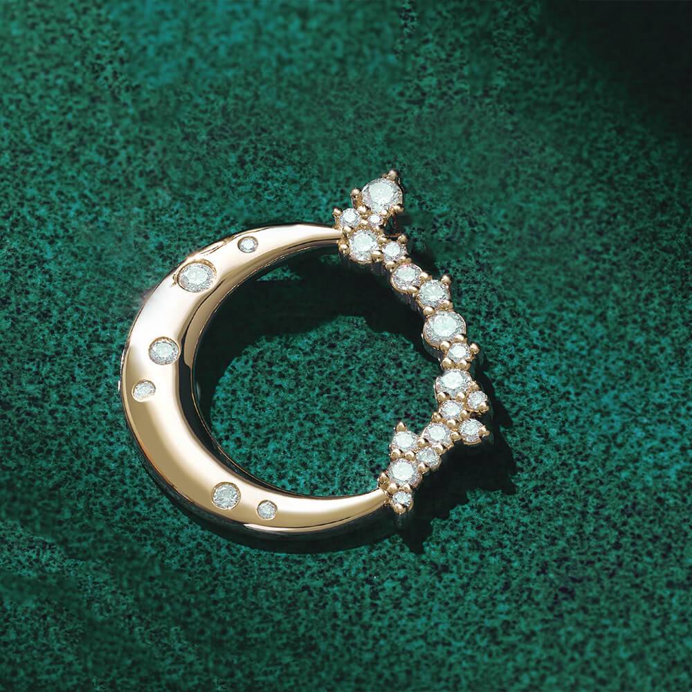 Close-up of diamond crescent moon pendant