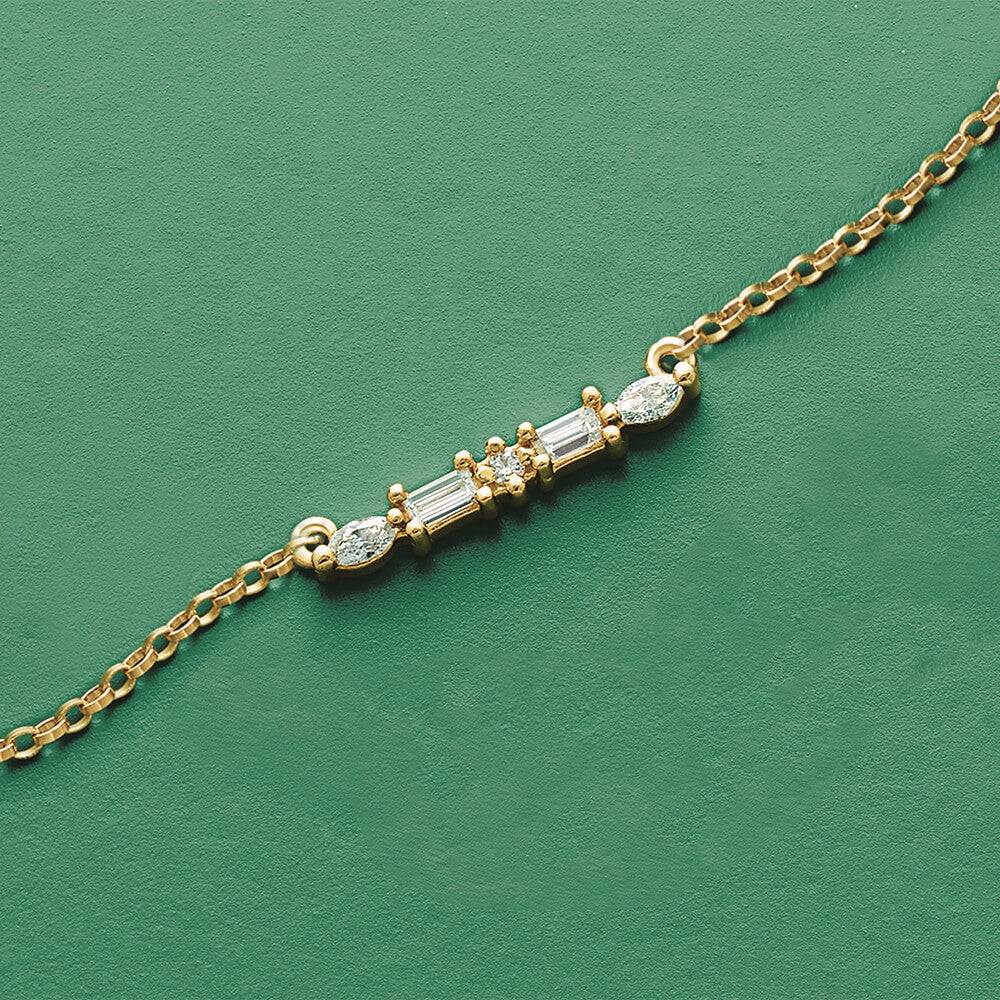 Diamond bar necklace on green background
