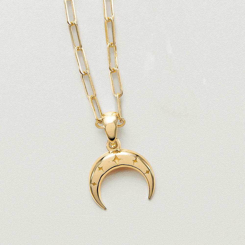 Gold crescent moon necklace with star details