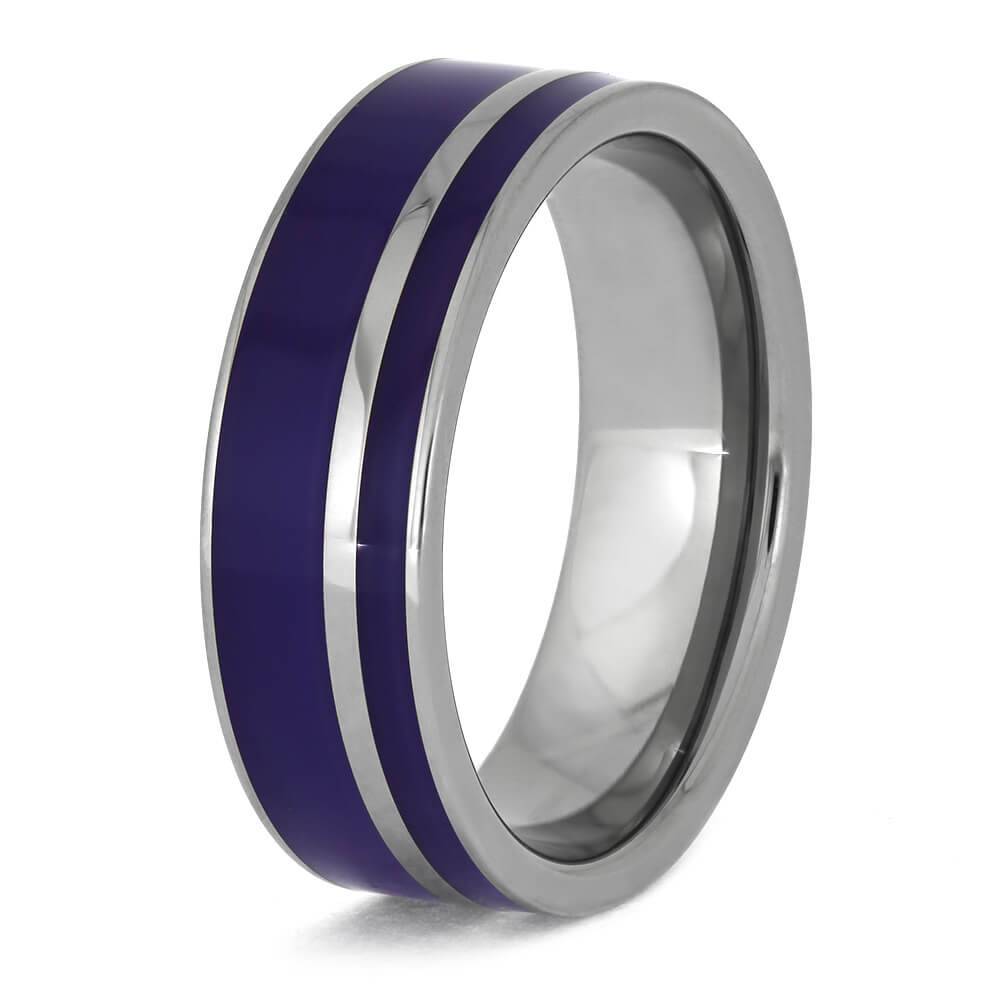 Angled view of titanium wedding band with purple enamel