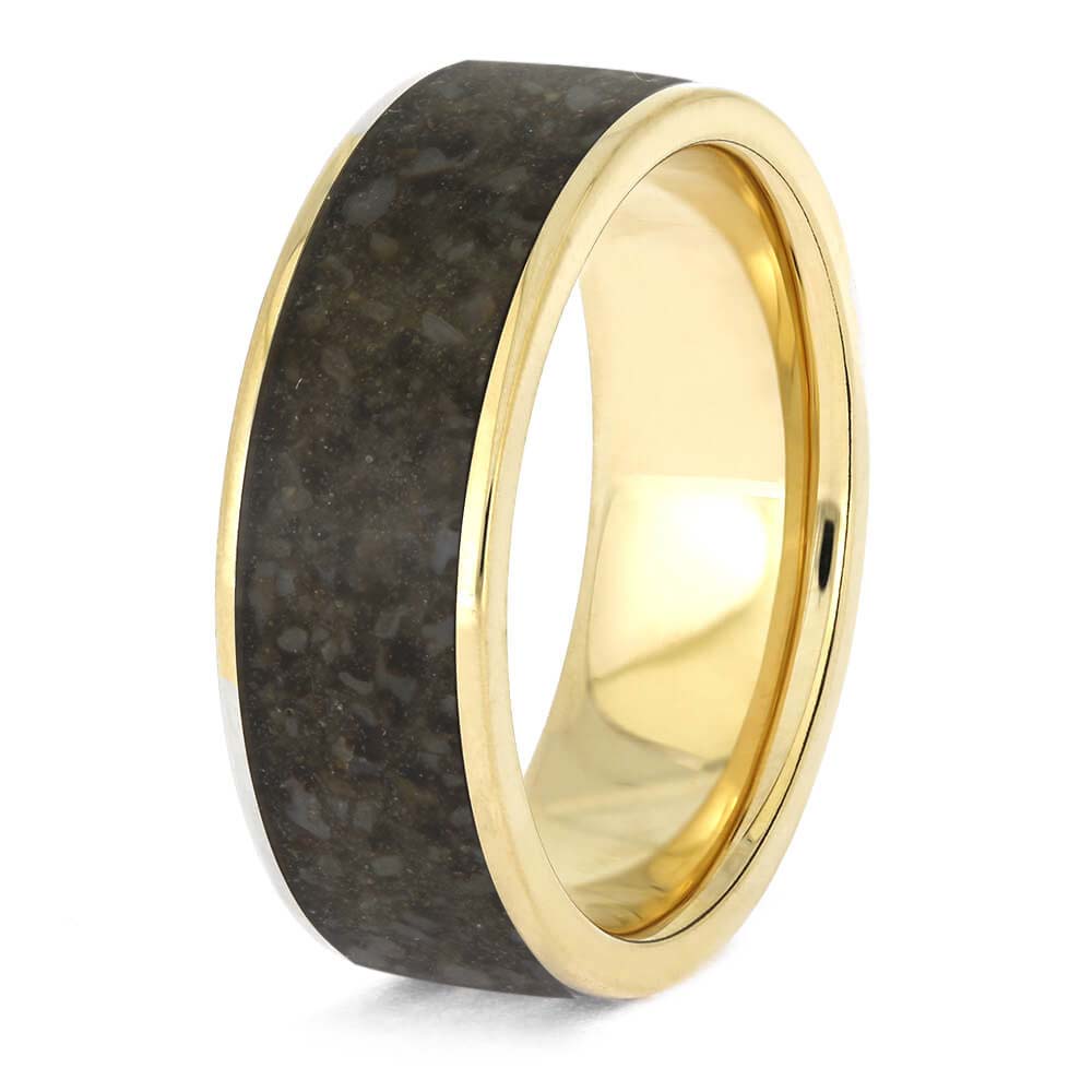 Gold and black ring on a white background