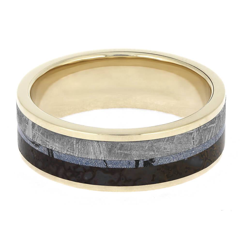 White gold ring showcasing meteorite and dinosaur bone