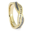 Unique gold wedding band with twisted design showcasing Gibeon meteorite and a row of sparkling diamonds. Ideal for women's wedding jewelry.