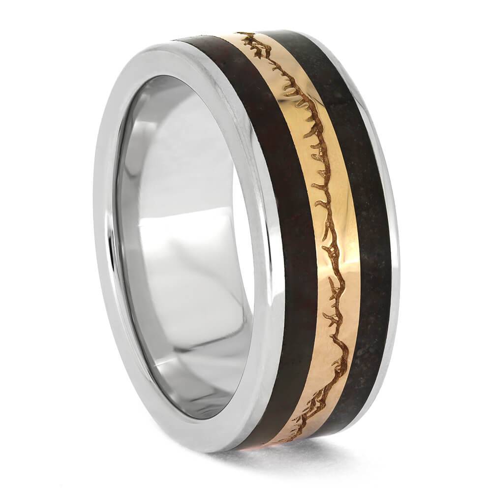 Side view of fossilized wood and bone ring with gold mountain