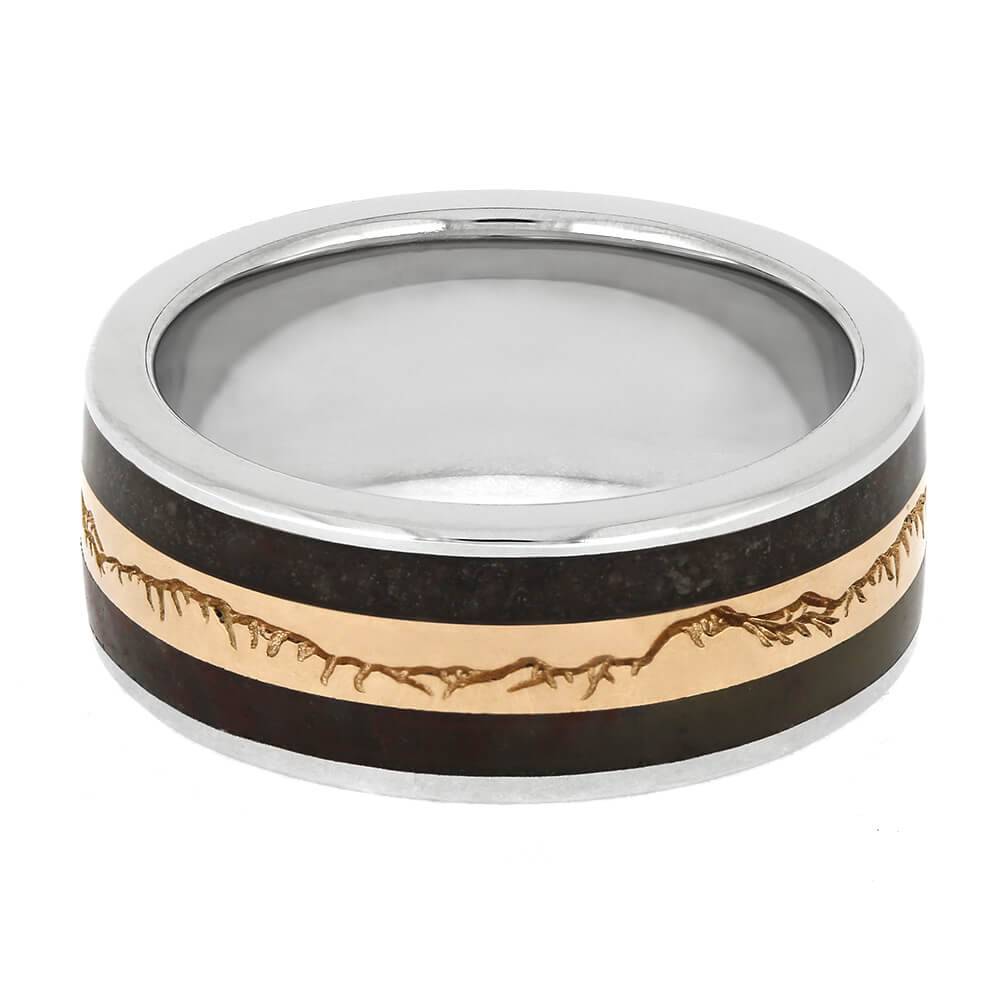 Top view of wedding band featuring gold mountain design