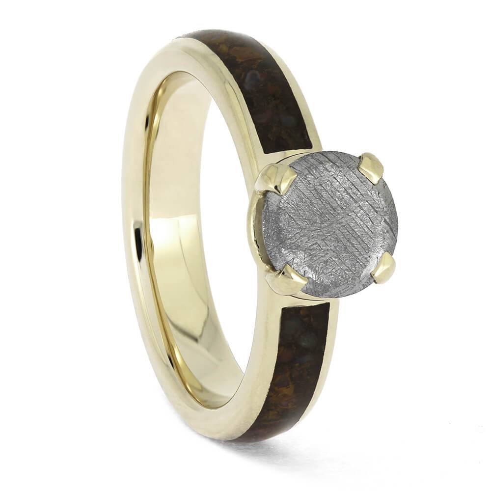 White gold ring featuring meteorite solitaire and dinosaur bone inlay