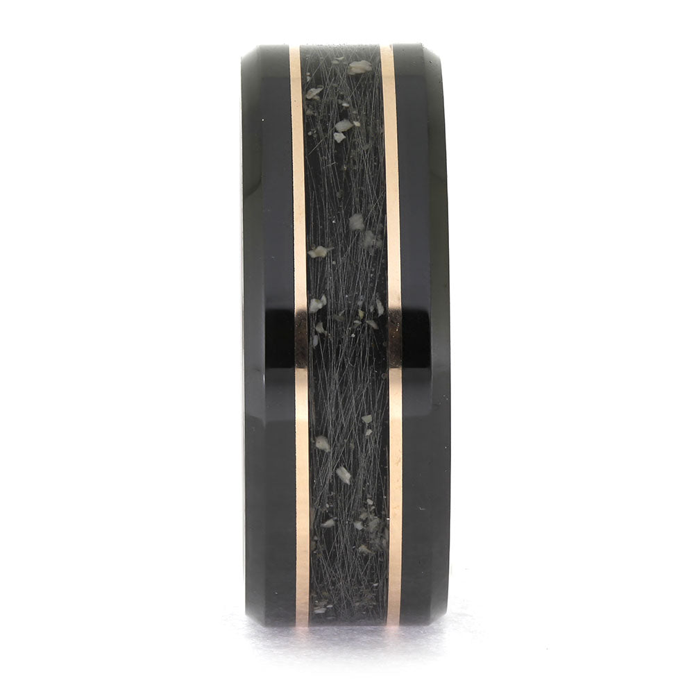 Black ring with rose gold inlay on a white background