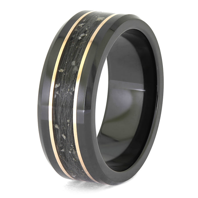 Black ring with gold inlay on a white background