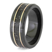 Black ring with gold inlay on a white background