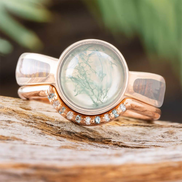 Rose gold wedding band with large central stone and diamonds