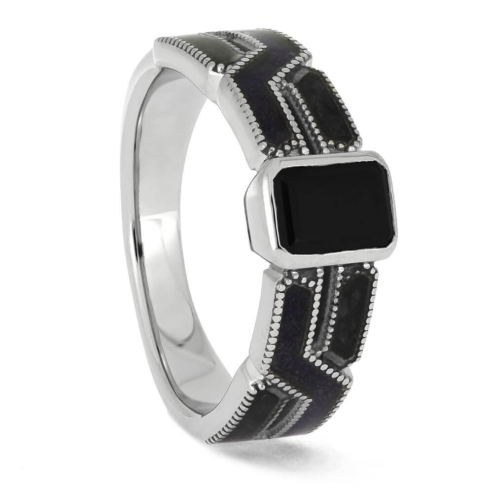 Side view of black engagement ring with onyx and amethyst