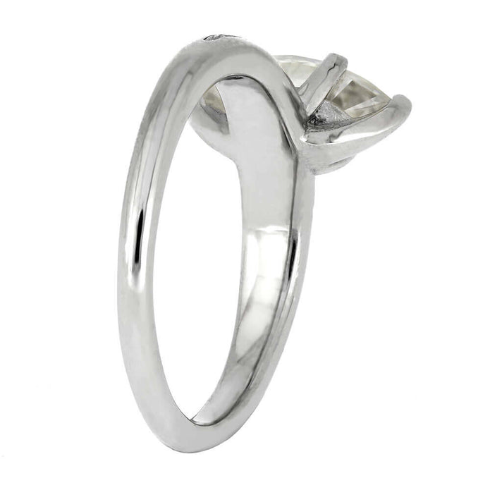 Silver ring with a diamond on a white background