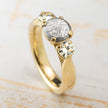 Classic three stone meteorite engagement ring in yellow gold