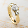 Classic three stone meteorite engagement ring in yellow gold
