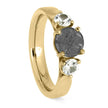 Yellow gold engagement ring with meteorite and two stones
