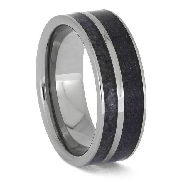 Titanium ring featuring a dark crushed birthstone inlay.