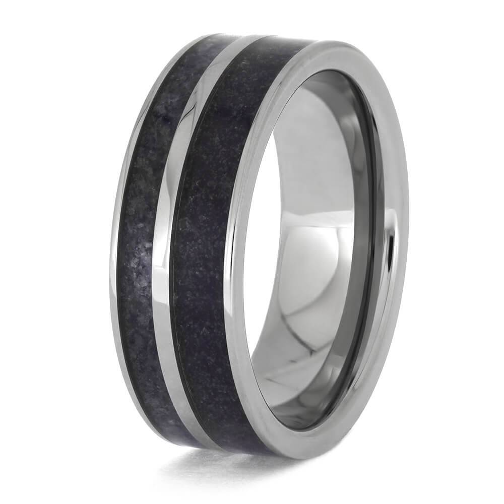 Angled view of titanium ring with dark crushed inlay.