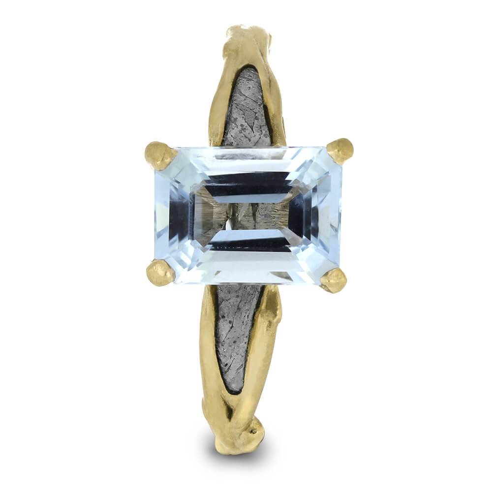 Aquamarine solitaire ring with meteorite detail