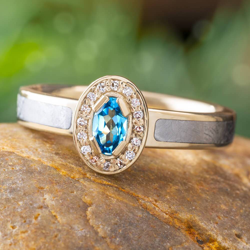 White gold halo ring with blue topaz and meteorite inlay