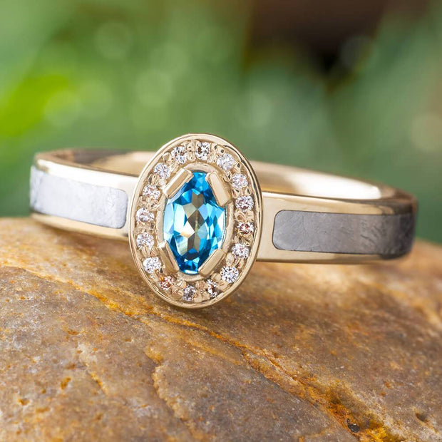 White gold halo ring with blue topaz and meteorite inlay