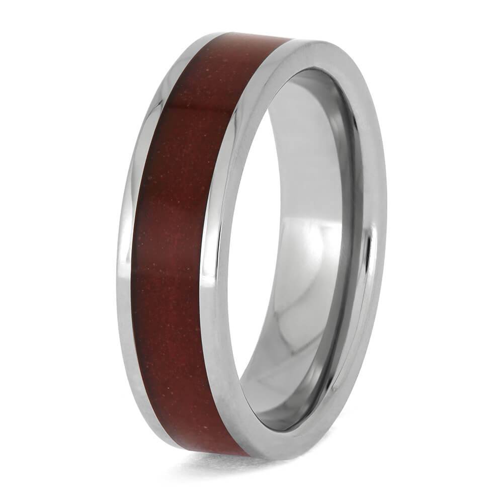 Angled view of red sand titanium wedding ring
