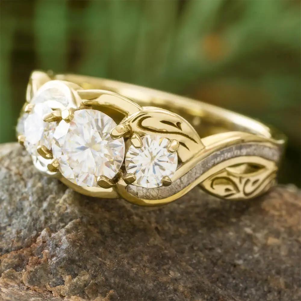 Three stone engagement ring in yellow gold with meteorite inlay