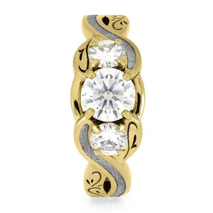 Front view of three stone yellow gold ring with meteorite accents