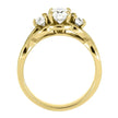 Profile view of three stone yellow gold ring with prong setting