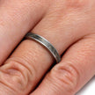 Titanium golf tee wedding band on finger