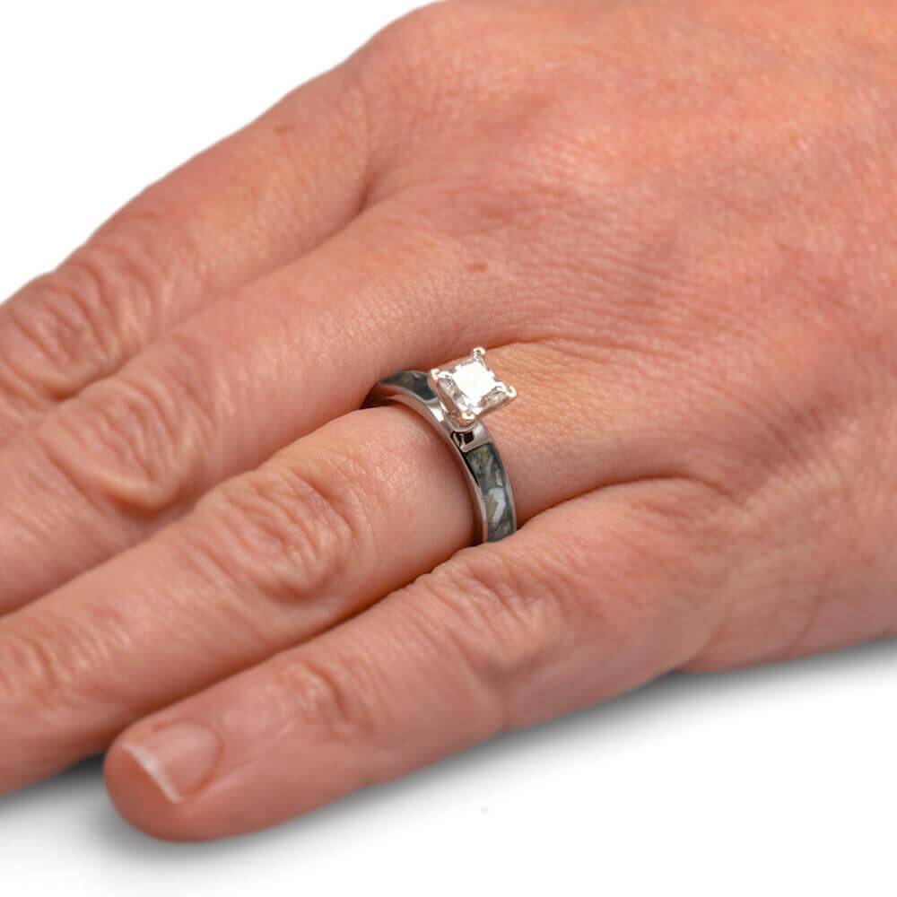 Diamond golf engagement ring worn on finger