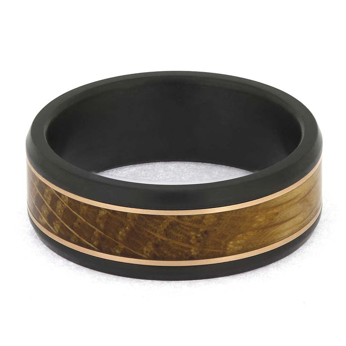 Matte-finish Black Zirconium Ring with warm whiskey barrel wood and Rose Gold pinstripes, handcrafted for men's wedding jewelry.