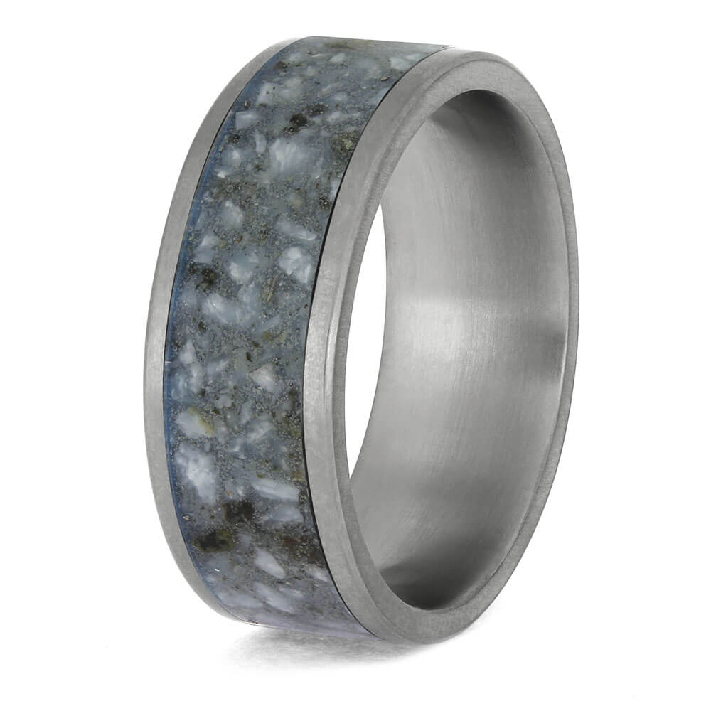 Silver ring with a textured gray band on a white background