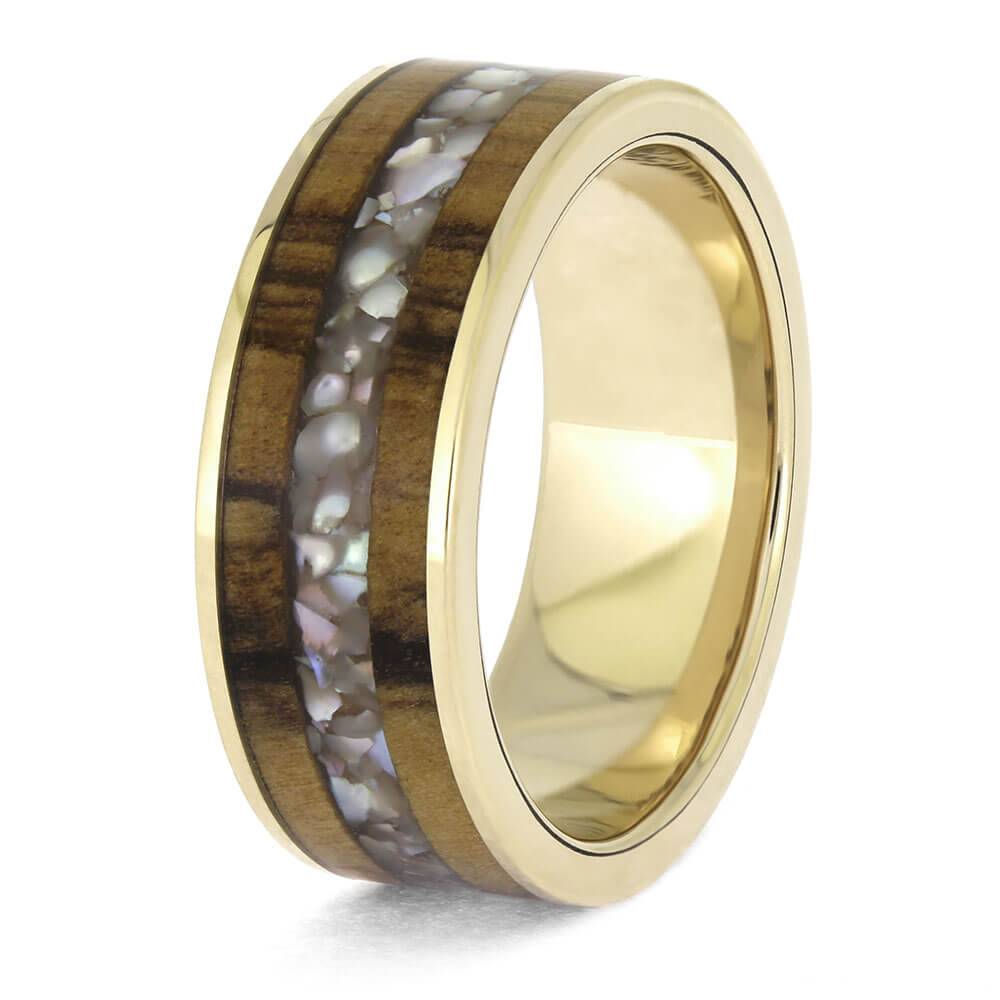 White gold ring featuring pearl and olive wood inlay