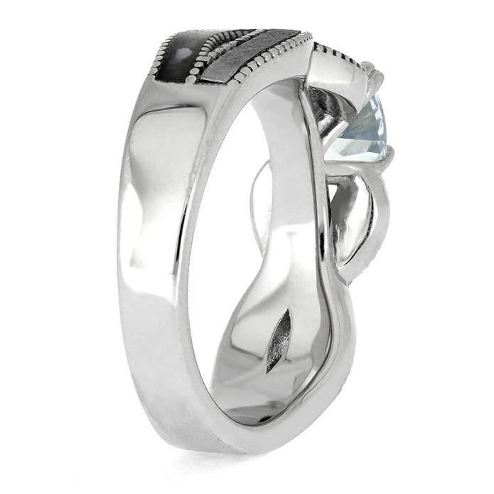 Silver ring with a large gemstone on a white background