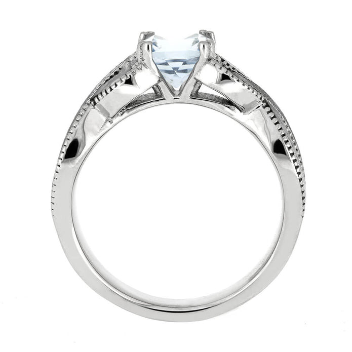 Silver ring with a central gemstone on a white background