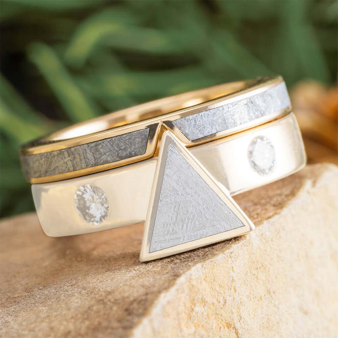Gold and silver ring with geometric design on a natural background
