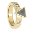 Gold ring with triangular design and embedded crystals on a white background
