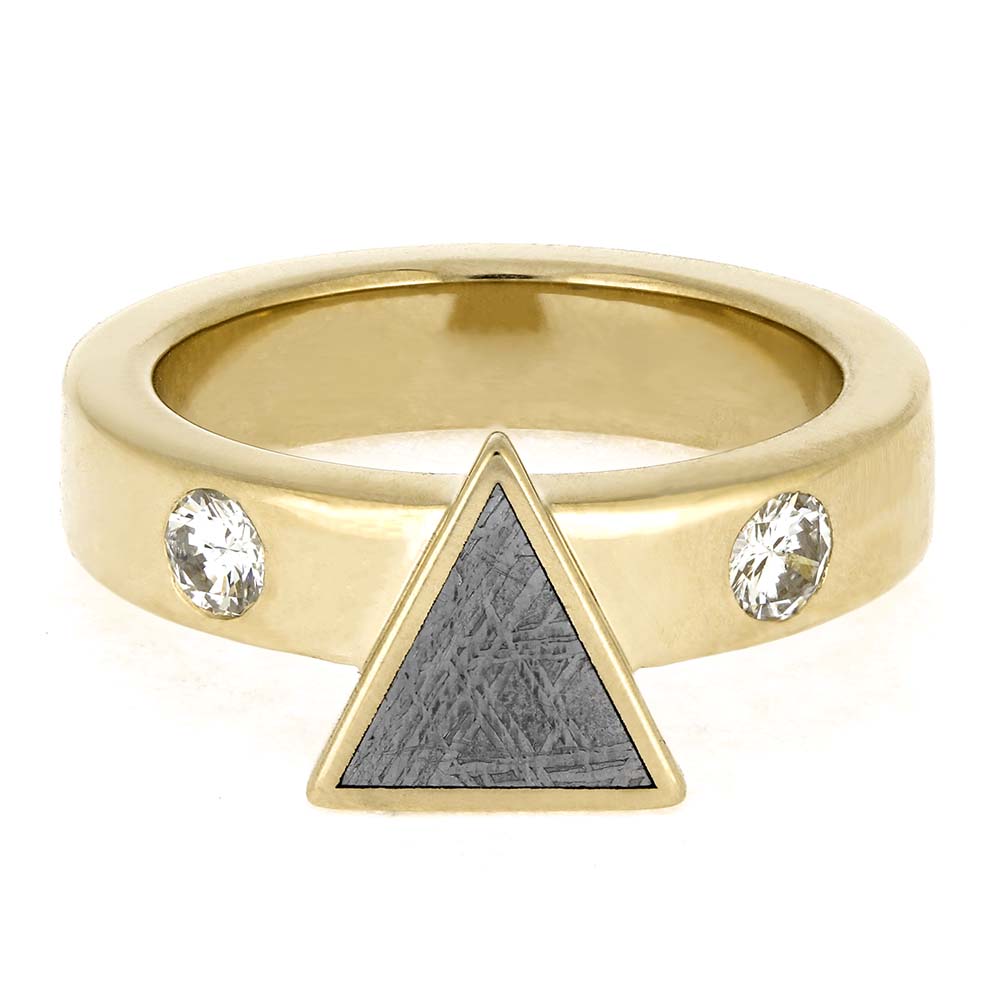Gold ring with a triangle and two crystals on a white background